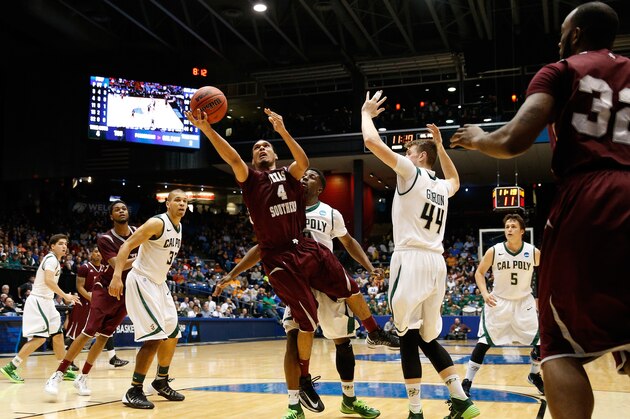 DAYTON, OH - MARCH 19: Jose Rodriguez #4 of the Texas Southern Tigers goes to the basket as Zach Gordon #44 of the Cal Poly Mustangs defends during the first round of the 2014 NCAA Men's Basketball Tournament at UD Arena on March 19, 2014 in Dayton, Ohio.  (Photo by Gregory Shamus/Getty Images)