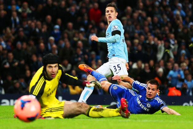 MANCHESTER, ENGLAND - FEBRUARY 15:  Steven Jovetic of Manchester City scores the first goal past Petr Cech of Chelsea during the FA Cup Fifth Round match sponsored by Budweiser between Manchester City and Chelsea at Etihad Stadium on February 15, 2014 in Manchester, England.  (Photo by Clive Brunskill/Getty Images)