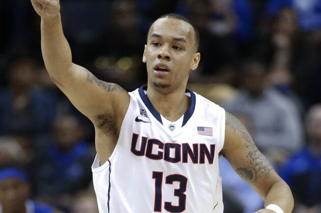 Connecticut guard Shabazz Napier celebrates a score against Memphis during the first half of an NCAA college basketball game in the quarterfinals of the American Athletic Conference men's tournament Thursday, March 13, 2014, in Memphis, Tenn. (AP Photo/Mark Humphrey)