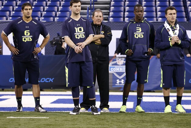 Feb 23, 2014; Indianapolis, IN, USA; Eastern Illinois quarterback James Garoppolo (FL),  Alabama Crimson Tide quarterback A.J. McCarron (L),  Louisville Cardinals quarterback Teddy Bridgewater (R), and Texas A&M Aggies quarterback Johnny Manziel (FR) look on during the 2014 NFL Combine at Lucas Oil Stadium. Mandatory Credit: Brian Spurlock-USA TODAY Sports