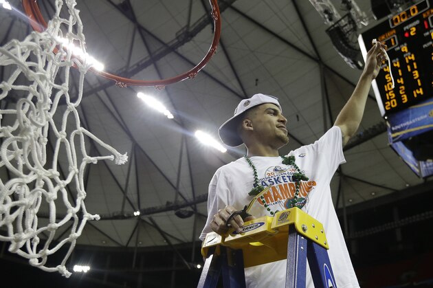 Florida guard Scottie Wilbekin shows a part of the net after the second half of an NCAA college basketball game against Kentucky in the Championship round of the Southeastern Conference men's tournament, Sunday, March 16, 2014, in Atlanta. Florida won 61-60.(AP Photo/Steve Helber) Florida guard Scottie Wilbekin shows a part of the net after the second half of an NCAA college basketball game against Kentucky in the Championship round of the Southeastern Conference men's tournament, Sunday, March 16, 2014, in Atlanta. Florida won 61-60.(AP Photo/Steve Helber)