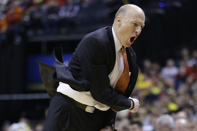 Illinois head coach John Groce reacts to a play in the second half of an NCAA college basketball game against Michigan in the quarterfinals of the Big Ten Conference tournament Friday, March 14, 2014, in Indianapolis. Michigan won 64-63. (AP Photo/Michael Conroy)
