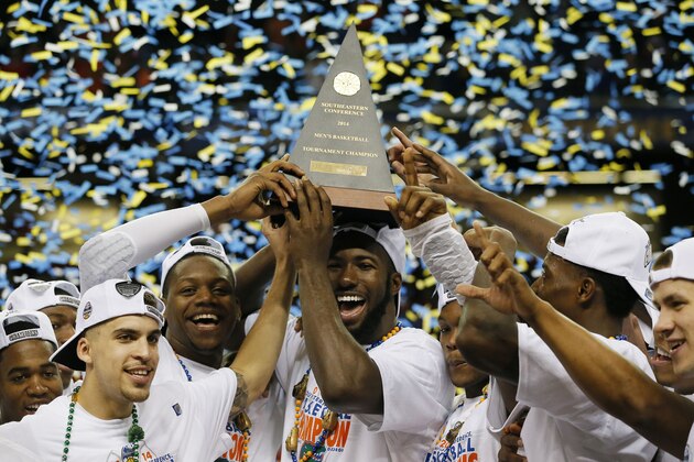 ATLANTA, GA - MARCH 16:  The Florida Gators celebrate with the trophy after their 61 to 60 win over the Kentucky Wildcats in the Championship game of the 2014 Men's SEC Basketball Tournament at Georgia Dome on March 16, 2014 in Atlanta, Georgia.  (Photo by Kevin C. Cox/Getty Images)