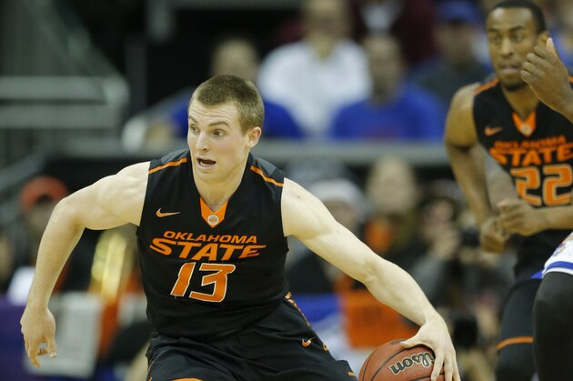 Oklahoma State guard Phil Forte, III (13) during the first half of an NCAA college basketball game against Kansas in the quarterfinals of the Big 12 Conference men's tournament in Kansas City, Mo., Thursday, March 13, 2014. (AP Photo/Orlin Wagner)