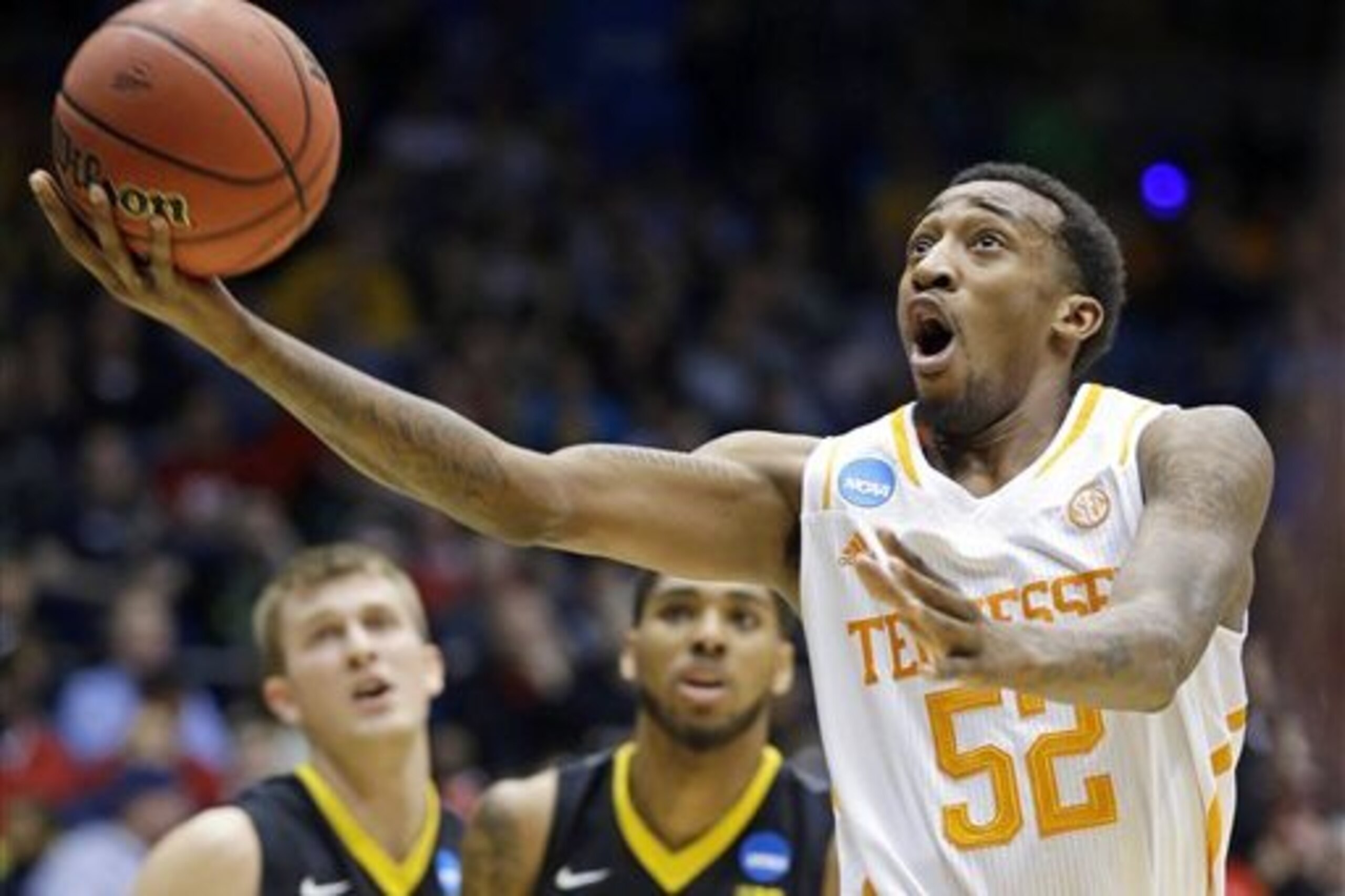 Tennessee guard Jordan McRae (52) drives against Iowa in the first half of a first-round game of the NCAA college basketball tournament on Wednesday, March 19, 2014, in Dayton, Ohio. (AP Photo/Al Behrman)