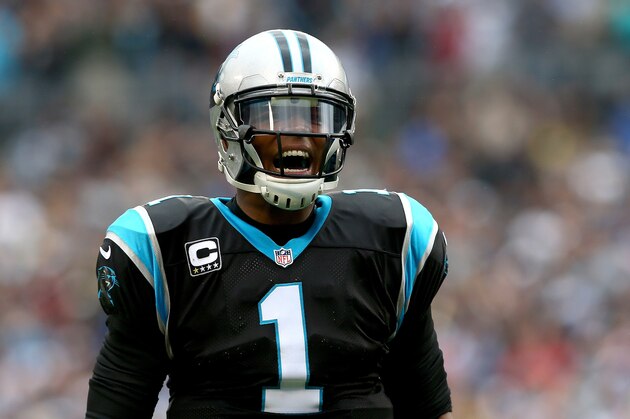 CHARLOTTE, NC - DECEMBER 22:  Cam Newton #1 of the Carolina Panthers celebrates after a touchdown by teammate DeAngelo Williams #34 during their game against the New Orleans Saints at Bank of America Stadium on December 22, 2013 in Charlotte, North Carolina.  (Photo by Streeter Lecka/Getty Images)
