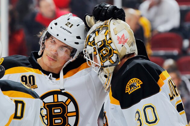 NEWARK, NJ - MARCH 18:  Winning goaltender Chad Johnson #30 of the Boston Bruins is congratulated by Loui Eriksson #21 after defeating the New Jersey Devils at the Prudential Center on March 18, 2014 in Newark, New Jersey.  The Bruins defeated the Devils 4-2. (Photo by Andy Marlin/NHLI via Getty Images)