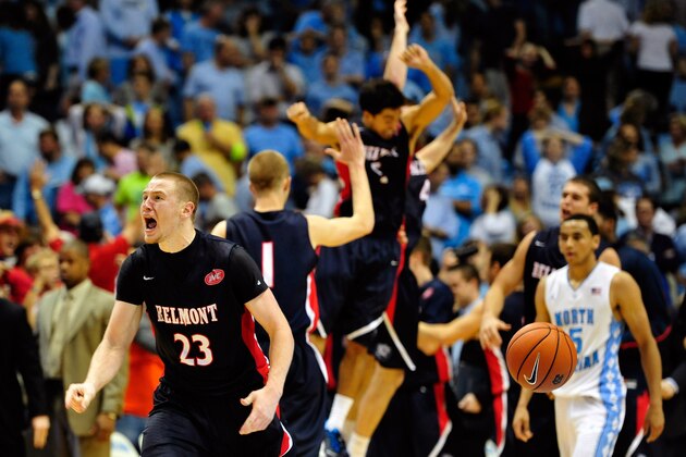 CHAPEL HILL, NC - NOVEMBER 17:  Craig Bradshaw #23 of the Belmont Bruins and teammates celebrate after a win as Marcus Paige #5 of the North Carolina Tar Heels walks off the court at the Dean Smith Center on November 17, 2013 in Chapel Hill, North Carolina. Belmont defeated North Carolina 83-80.  (Photo by Grant Halverson/Getty Images)