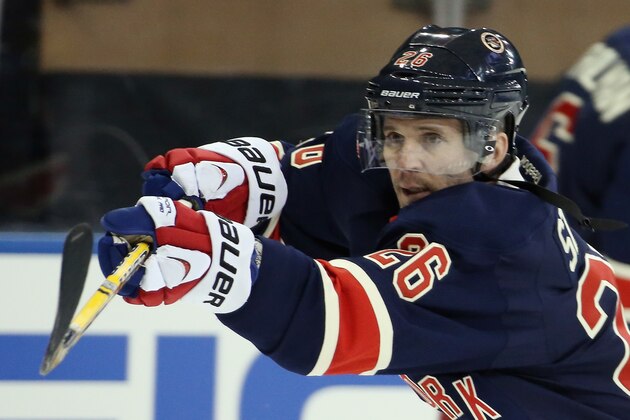 NEW YORK, NY - MARCH 05:  Martin St. Louis #26 of the New York Rangers takes a shot in warmups prior to playing in his first game as a Ranger against the Toronto Maple Leafs at Madison Square Garden on March 5, 2014 in New York City.  (Photo by Bruce Bennett/Getty Images)