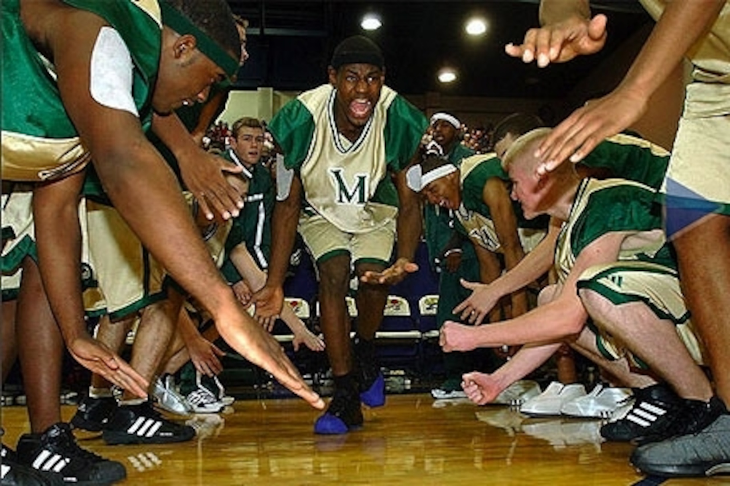 Akron St. Vincent-St. Marys high school star LeBron James holds up one finger during the team's 65-45 win over Virginia's Oak Hill Academy Thursday, Dec. 12, 2002, in Cleveland. James gesture proved prophetic as USA Today named the Irish the top high school basketball team in the country Tuesday, Jan. 7, 2003. (AP Photo/Mark Duncan, File)