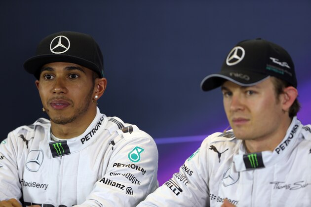 MELBOURNE, AUSTRALIA - MARCH 15:  First placed Lewis Hamilton (L) of Great Britain and Mercedes GP and third placed Nico Rosberg (R) of Germany and Mercedes GP attend the official press conference following qualifying for the Australian Formula One Grand Prix at Albert Park on March 15, 2014 in Melbourne, Australia.  (Photo by Mark Thompson/Getty Images)