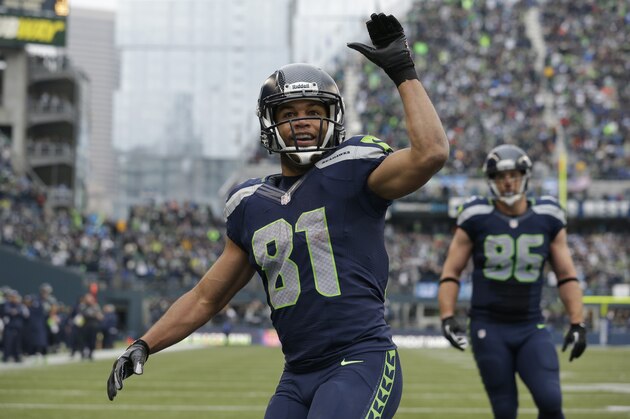 Seattle Seahawks' Golden Tate motions to fans after scoring against the St. Louis Rams in the second half of an NFL football game, Sunday, Dec. 29, 2013, in Seattle. (AP Photo/Elaine Thompson)