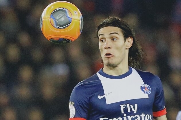 Paris Saint Germain's striker Edinson Cavani of Uruguay looks the  the ball during their French League One soccer match against Lyon  Sunday Dec. 1, 2013, in Parc des Princes stadium, in Paris, France. (AP Photo/Jacques Brinon)