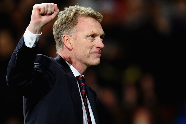 MANCHESTER, ENGLAND - MARCH 19:  Manchester United Manager David Moyes celebrates at the end of the UEFA Champions League Round of 16 second round match between Manchester United and Olympiacos FC at Old Trafford on March 19, 2014 in Manchester, England.  (Photo by Laurence Griffiths/Getty Images)