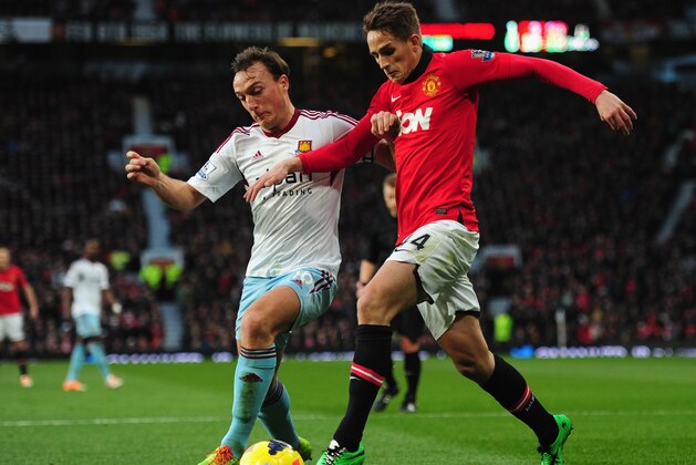 MANCHESTER, ENGLAND - DECEMBER 21:  Adnan Januzaj of Manchester United competes with Mark Noble of West Ham United during the Barclays Premier League match between Manchester United and West Ham United at Old Trafford on December 21, 2013 in Manchester, England.  (Photo by Stu Forster/Getty Images)