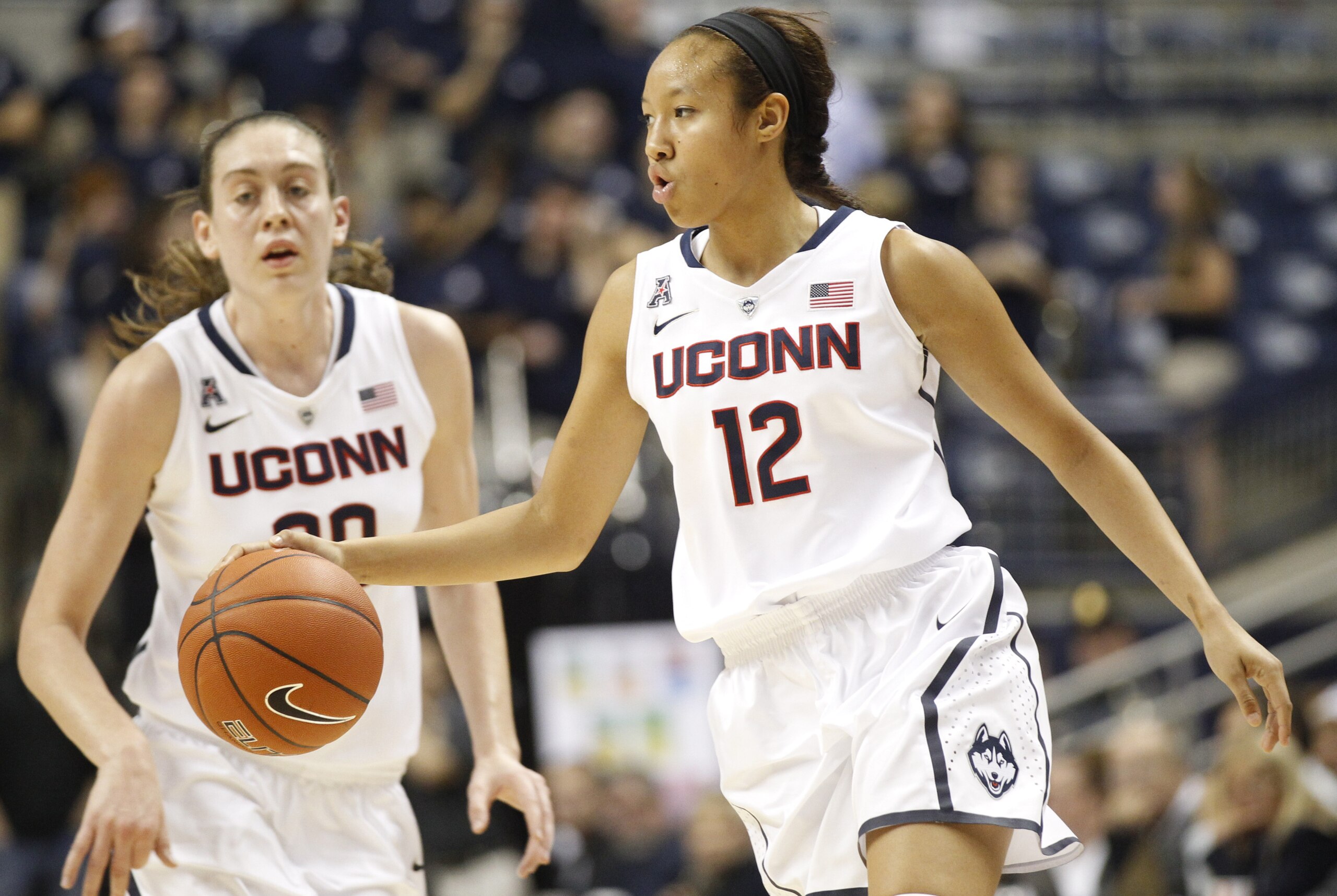 Nov 22, 2013; Storrs, CT, USA; Connecticut Huskies guard Saniya Chong (12) and forward Breanna Stewart (30) return the ball up court against the Boston University Terriers in the second half at Gampel Pavilion. UConn defeated Boston 96-38. Mandatory Credit: David Butler II-USA TODAY Sports