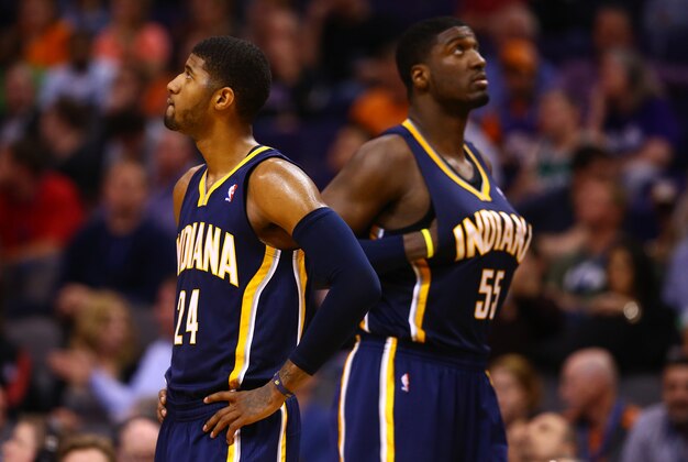 Jan 22, 2014; Phoenix, AZ, USA; Indiana Pacers forward Paul George (left) and center Roy Hibbert react in the second half against the Phoenix Suns at US Airways Center. The Suns defeated the Pacers 124-100. Mandatory Credit: Mark J. Rebilas-USA TODAY Sports