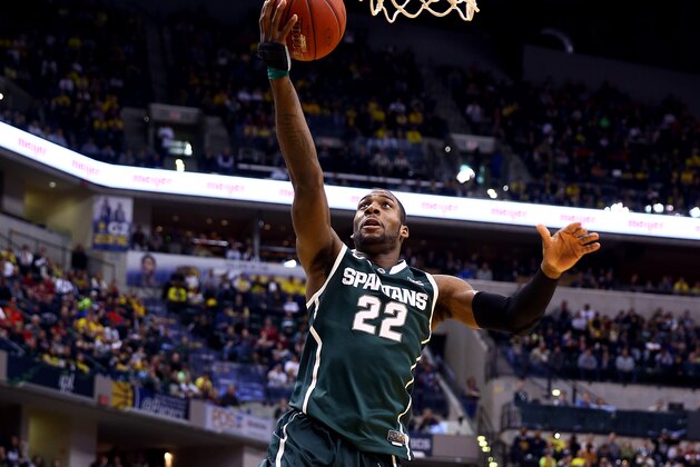 INDIANAPOLIS, IN - MARCH 16:  Branden Dawson #22 of the Michigan State Spartans goes to the basket against the Michigan Wolverines during the 2014 Big Ten Men's Championship at Bankers Life Fieldhouse on March 16, 2014 in Indianapolis, Indiana.  (Photo by Andy Lyons/Getty Images)
