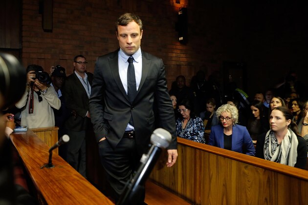PRETORIA, SOUTH AFRICA - AUGUST 19:  South African athlete Oscar Pistorius appears in Pretoria Magistrates Court for an indictment hearing on August 19, 2013 in Pretoria, South Africa. Pistorius, 26 is accused of murdering his girlfriend Reeva Steenkamp which Pistorius denies claiming he mistook Steenkamp for an intruder. The indictment was served and the trial date of March 3, 2014 was set in Pretoria Magistrates Court.  (Photo by Jemal Countess/Getty Images)
