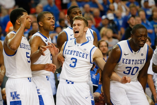 ATLANTA, GA - MARCH 15:  Andrew Harrison #5, Aaron Harrison #2, Jarrod Polson #3 and Julius Randle #30 of the Kentucky Wildcats react to a play against the Georgia Bulldogs during the semifinals of the SEC Men's Basketball Tournament at Georgia Dome on March 15, 2014 in Atlanta, Georgia.  (Photo by Kevin C. Cox/Getty Images)