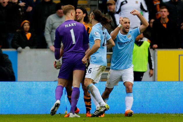HULL, ENGLAND - MARCH 15: Goalkeeper Joe Hart of Manchester City and George Boyd of Hull City clash following a penalty area incident during the Barclays Premier league match between Hull City and Manchester City at KC Stadium on March 15, 2014 in Hull, England. (Photo by Paul Thomas/Getty Images) HULL, ENGLAND - MARCH 15: Goalkeeper Joe Hart of Manchester City and George Boyd of Hull City clash following a penalty area incident during the Barclays Premier league match between Hull City and Manchester City at KC Stadium on March 15, 2014 in Hull, England. (Photo by Paul Thomas/Getty Images)
