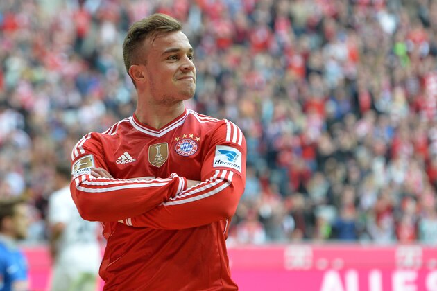 Bayern's Xherdan Shaqiri of Switzerland smiles after scoring during the German first division Bundesliga soccer match between FC Bayern Munich and SC Freiburg in Munich, Germany, on Saturday, Feb. 15, 2014. (AP Photo/Kerstin Joensson)