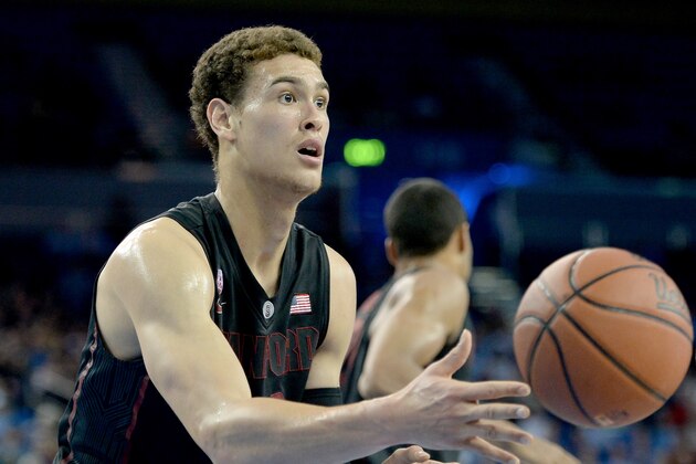 LOS ANGELES, CA - JANUARY 23:  Dwight Powell #33 of the Stanford Cardinal passes after grabbling a rebound against the UCLA Bruins at Pauley Pavilion on January 23, 2014 in Los Angeles, California.  (Photo by Harry How/Getty Images)