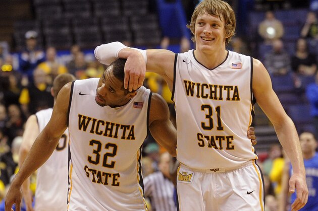 Wichita State's Ron Baker (31) and Tekele Cotton (32) celebrate late in the second half of an NCAA college basketball game against Indiana State for the championship of the Missouri Valley Conference Sunday, March 9, 2014, in St. Louis. (AP Photo/Bill Boyce)