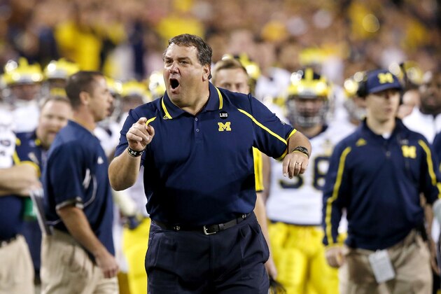 Michigan coach Brady Hoke yells at officials during the first half of the Buffalo Wild Wings Bowl NCAA college football game against Kansas State on Saturday, Dec. 28, 2013, in Tempe, Ariz. (AP Photo/Ross D. Franklin) Michigan coach Brady Hoke yells at officials during the first half of the Buffalo Wild Wings Bowl NCAA college football game against Kansas State on Saturday, Dec. 28, 2013, in Tempe, Ariz. (AP Photo/Ross D. Franklin)
