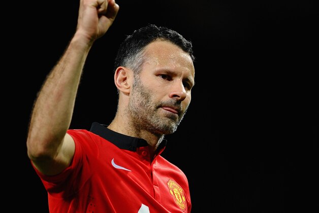 MANCHESTER, ENGLAND - MARCH 19:  Ryan Giggs of Manchester United celebrates at the end of the UEFA Champions League Round of 16 second round match between Manchester United and Olympiacos FC at Old Trafford on March 19, 2014 in Manchester, England.  (Photo by Laurence Griffiths/Getty Images)
