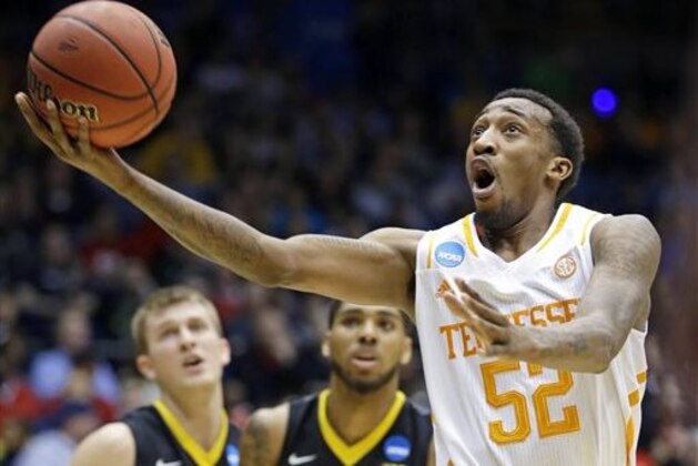 Tennessee guard Jordan McRae (52) drives against Iowa in the first half of a first-round game of the NCAA college basketball tournament on Wednesday, March 19, 2014, in Dayton, Ohio. (AP Photo/Al Behrman)