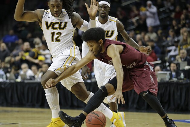 VCU's Mo Alie-Cox, left, fouls Saint Joseph's DeAndre Bembry, right, while Briante Weber looks on during the second half of an NCAA college basketball game in the championship round of the Atlantic 10 Conference tournament at the Barclays Center in New York, Sunday, March 16, 2014. St. Joseph's defeated VCU 65-61. (AP Photo/Seth Wenig)