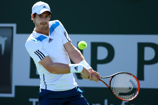 INDIAN WELLS, CA - MARCH 12:  Andy Murray of Great Britain hits a return to Milos Raonic of Canada during the BNP Paribas Open at Indian Wells Tennis Garden on March 12, 2014 in Indian Wells, California.  (Photo by Stephen Dunn/Getty Images).  (Photo by Stephen Dunn/Getty Images)