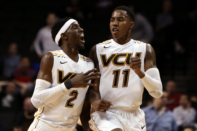 NEW YORK, NY - MARCH 15:  Briante Weber #2 and Rob Brandenberg #11 of the Virginia Commonwealth Rams celebrate after a basket by Brandenberg to end the first half against the George Washington Colonials during the Semifinals of the 2014 Atlantic 10 Men's Basketball Tournament  at Barclays Center on March 15, 2014 in the Brooklyn borough of New York City.  (Photo by Mike Lawrie/Getty Images)