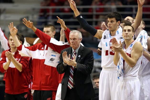MILWAUKEE, WI - MARCH 20:  Head coach Bo Ryan of the Wisconsin Badgers applauds from the bench alongside players during the second round game of the NCAA Basketball Tournament against the American University Eagles at BMO Harris Bradley Center on March 20, 2014 in Milwaukee, Wisconsin.  (Photo by Jonathan Daniel/Getty Images)