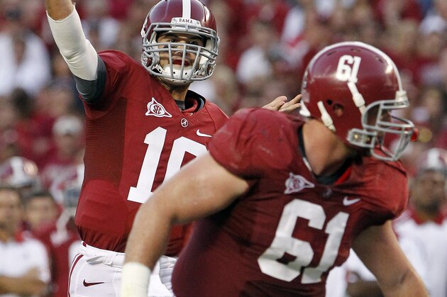 FILE - In this Oct. 8, 2011, file photo, Alabama quarterback AJ McCarron (10) looks for a receiver as offensive linesman Anthony Steen (61) blocks in the first half of an NCAA college football game at Bryant-Denny Stadium in Tuscaloosa, Ala. Second-ranked Alabama are slated to host No. 1 LSU on Saturday, Nov. 5, 2011. (AP Photo/Dave Martin, File)