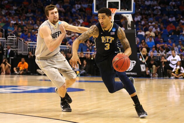 ORLANDO, FL - MARCH 20:  Cameron Wright #3 of the Pittsburgh Panthers drives on Eli Stalzer #5 of the Colorado Buffaloes in the second half during the second round of the 2014 NCAA Men's Basketball Tournament at Amway Center on March 20, 2014 in Orlando, Florida.  (Photo by Mike Ehrmann/Getty Images)