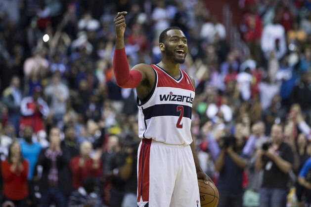 Washington Wizards guard John Wall celebrates as the clock winds down during the second half of an NBA basketball game against the Brooklyn Nets on Saturday, March 15, 2014, in Washington. Wall scored a game high 33 points in the Wizards 101-94 victory over the Nets. (AP Photo/ Evan Vucci) Washington Wizards guard John Wall celebrates as the clock winds down during the second half of an NBA basketball game against the Brooklyn Nets on Saturday, March 15, 2014, in Washington. Wall scored a game high 33 points in the Wizards 101-94 victory over the Nets. (AP Photo/ Evan Vucci)