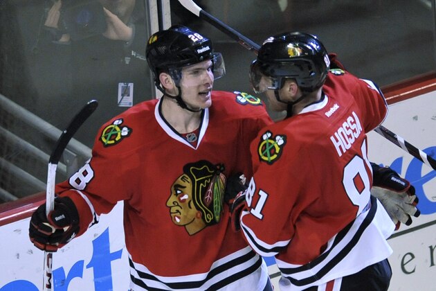 Chicago Blackhawks' Ben Smith (28), celebrates with teammate Marian Hossa (81), after scoring during the third period of an NHL hockey game against the St. Louis Blues in Chicago, Wednesday, March, 19, 2014. Chicago won 4-0. (AP Photo/Paul Beaty) Chicago Blackhawks' Ben Smith (28), celebrates with teammate Marian Hossa (81), after scoring during the third period of an NHL hockey game against the St. Louis Blues in Chicago, Wednesday, March, 19, 2014. Chicago won 4-0. (AP Photo/Paul Beaty)