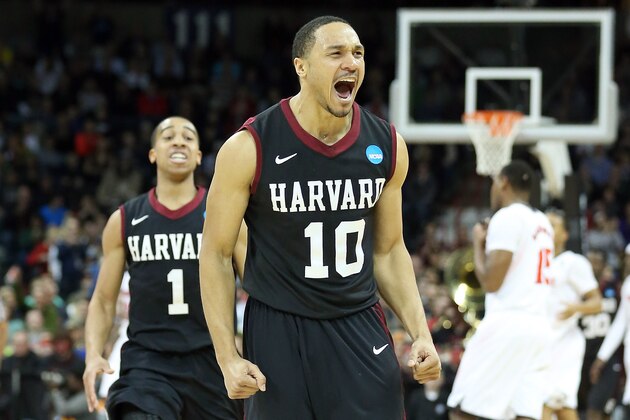 SPOKANE, WA - MARCH 20:  Brandyn Curry #10 and Siyani Chambers #1 of the Harvard Crimson celebrate after they beat the Cincinnati Bearcats during the second round of the 2014 NCAA Men's Basketball Tournament at Spokane Veterans Memorial Arena on March 20, 2014 in Spokane, Washington.  (Photo by Stephen Dunn/Getty Images)
