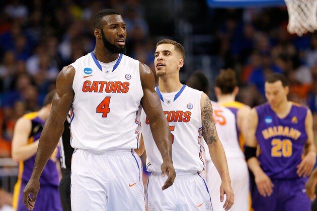 ORLANDO, FL - MARCH 20:  Patric Young #4 reacts with teammate Scottie Wilbekin #5 of the Florida Gators in the second half against the Albany Great Danes during the second round of the 2014 NCAA Men's Basketball Tournament at Amway Center on March 20, 2014 in Orlando, Florida.  (Photo by Kevin C. Cox/Getty Images)