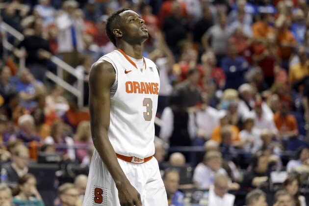 Syracuse's Jerami Grant (3) walks off the court after their loss to North Carolina State in a quarterfinal NCAA college basketball game at the Atlantic Coast Conference tournament in Greensboro, N.C., Friday, March 14, 2014. North Carolina State won 66-63. (AP Photo/Gerry Broome)