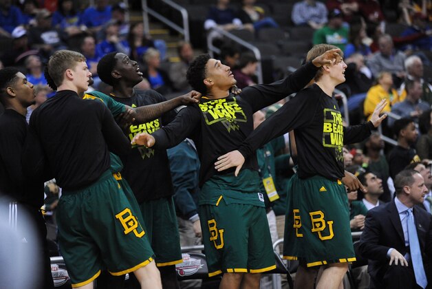 Mar 14, 2014; Kansas City, MO, USA; Baylor Bears players celebrate as they watch a replay during the first half against the Texas Longhorns in the semifinals of the Big 12 Conference college basketball tournament at Sprint Center. Mandatory Credit: Denny Medley-USA TODAY Sports Mar 14, 2014; Kansas City, MO, USA; Baylor Bears players celebrate as they watch a replay during the first half against the Texas Longhorns in the semifinals of the Big 12 Conference college basketball tournament at Sprint Center. Mandatory Credit: Denny Medley-USA TODAY Sports