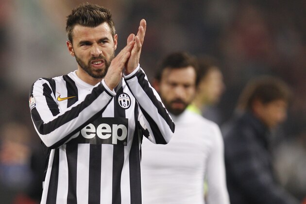 Juventus' Andrea Barzagli salutes supporters during an Italian Cup, round of eight, soccer match, between AS Roma and Juventus at Rome's Olympic stadium, Tuesday, Jan. 21, 2014. (AP Photo/Alessandra Tarantino)