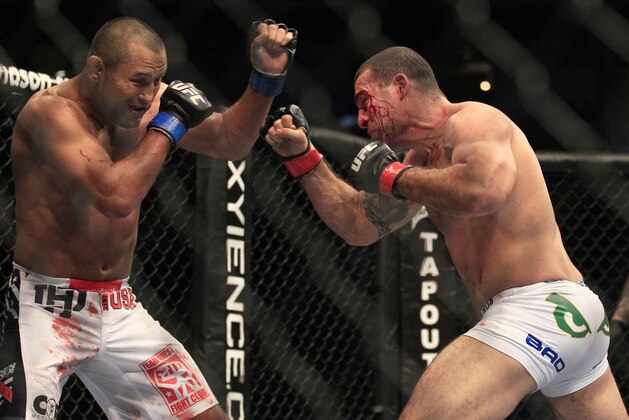 Mauricio Rua, right, fights Dan Henderson during a UFC 139 Mixed Martial Arts light heavyweight bout in San Jose, Calif., Saturday, Nov. 19, 2011. (AP Photo/Jeff Chiu)