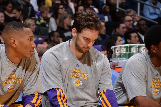 LOS ANGELES, CA - MARCH 19: Pau Gasol #16 of the Los Angeles Lakers looks on from the bench during a game against the San Antonio Spurs at Staples Center on March 19, 2014 in Los Angeles, California. NOTE TO USER: User expressly acknowledges and agrees that, by downloading and/or using this Photograph, user is consenting to the terms and conditions of the Getty Images License Agreement. Mandatory Copyright Notice: Copyright 2014 NBAE (Photo by Andrew D. Bernstein/NBAE via Getty Images)