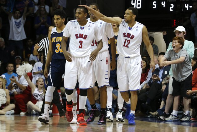 SMU guard Sterling Brown (3) celebrates with teammates forward Ben Moore (34) and guard Nick Russell (12) as UC Irvine guard Aaron Wright (32) walks away with during the second half of an NCAA college basketball game in the first round of the NIT Wednesday, March 19, 2014, in Dallas. SMU won 68-54. (AP Photo/Sharon Ellman) SMU guard Sterling Brown (3) celebrates with teammates forward Ben Moore (34) and guard Nick Russell (12) as UC Irvine guard Aaron Wright (32) walks away with during the second half of an NCAA college basketball game in the first round of the NIT Wednesday, March 19, 2014, in Dallas. SMU won 68-54. (AP Photo/Sharon Ellman)