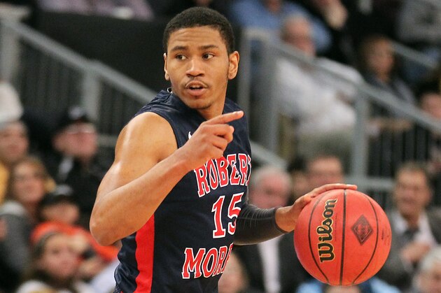 Robert Morris guard Karvel Anderson (15) dribbles the ball against Providence during the second half of an NCAA college basketball game in the second round of the NIT in Providence, R.I., Monday, March 25, 2013. Providence defeated Robert Morris 77-68. (AP Photo/Stew Milne)