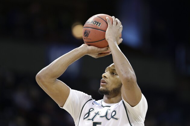 Michigan State's Adreian Payne shoots a free throw against Delaware in the second half during the second round of the NCAA men's college basketball tournament in Spokane, Wash., Thursday, March 20, 2014. Michigan State won 93-78. (AP Photo/Elaine Thompson)
