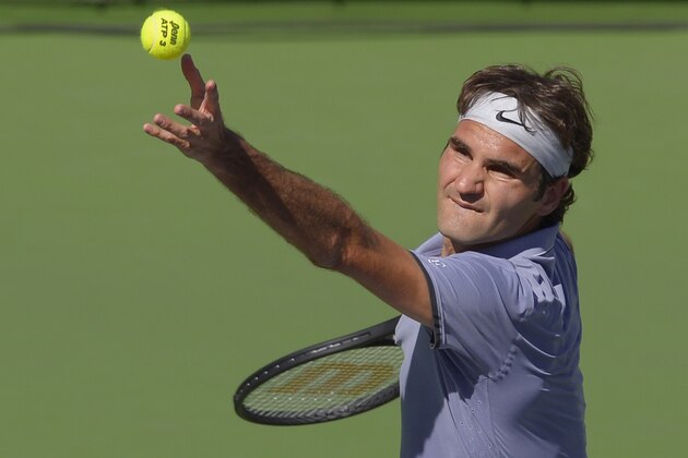 Roger Federer, of Switzerland, serves to Novak Djokovic, of Serbia, in the final match of the BNP Paribas Open tennis tournament, Sunday, March 16, 2014, in Indian Wells, Calif. (AP Photo/Mark J. Terrill)